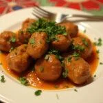 Served revuelto de morcillas garnished for a traditional Spanish meal.
